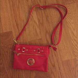 Red cross body purse with gold hardware